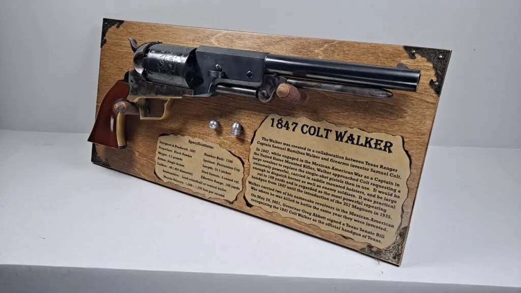 Vintage-style handgun display with brass corner accents