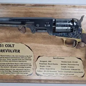 Ornate percussion pistol showcased on aged wood